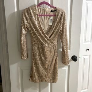 Long sleeve wrap front gold sequin dress. Size M, fits like a Small.